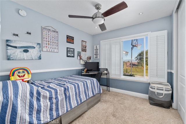 bedroom with ceiling fan and carpet flooring