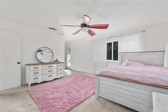 carpeted bedroom featuring ceiling fan