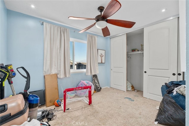 game room with ceiling fan and carpet