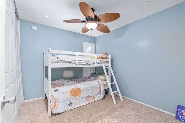 bedroom featuring ceiling fan and light carpet