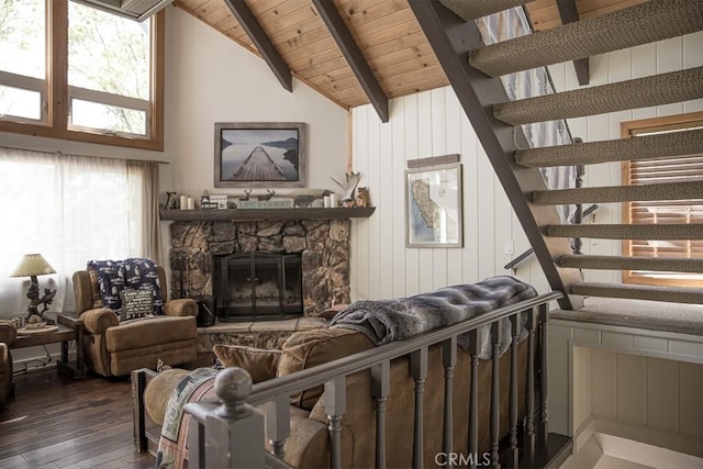 living room with wood ceiling, wooden walls, a fireplace, dark hardwood / wood-style floors, and lofted ceiling with beams