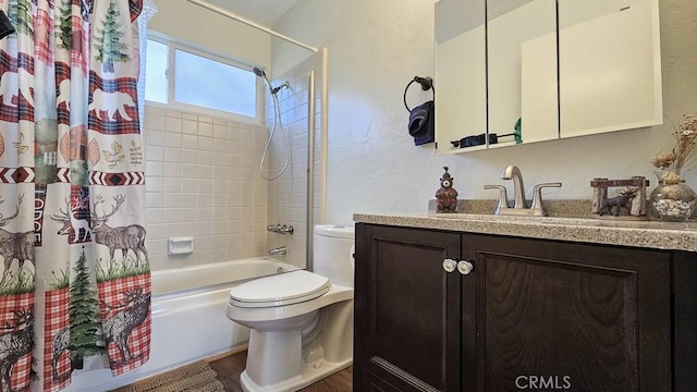 full bathroom featuring toilet, vanity, and shower / bathtub combination with curtain