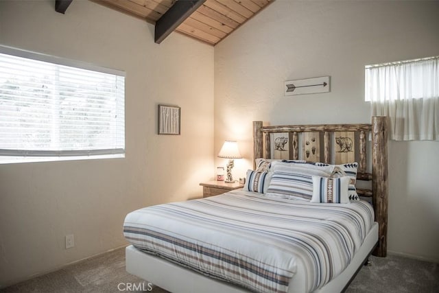 bedroom featuring wooden ceiling, carpet, and vaulted ceiling with beams