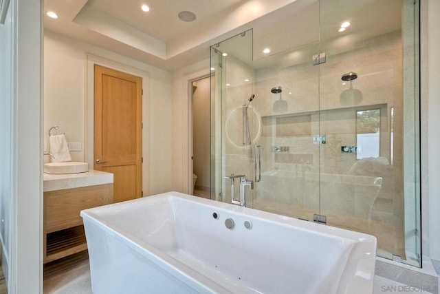 bathroom with shower with separate bathtub and toilet