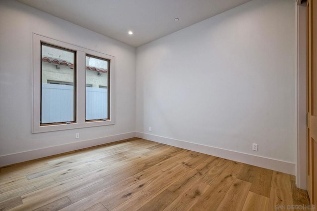 unfurnished room with light hardwood / wood-style flooring