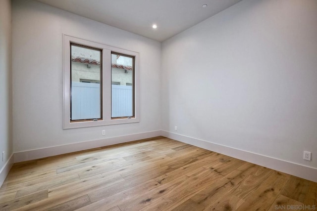 spare room with light hardwood / wood-style floors