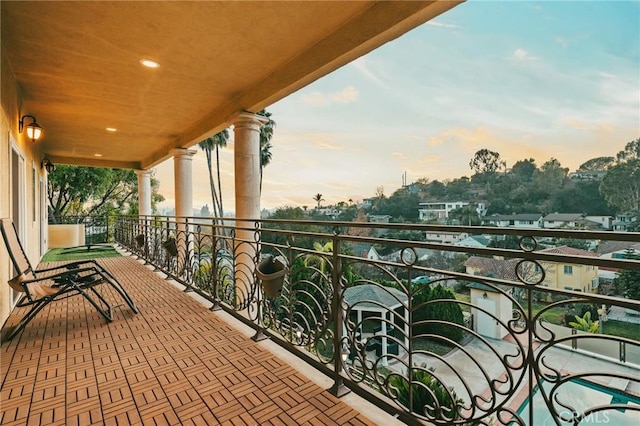 view of balcony at dusk