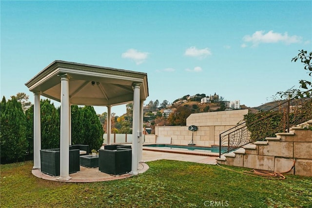 view of yard with an outdoor hangout area, a swimming pool, and a gazebo