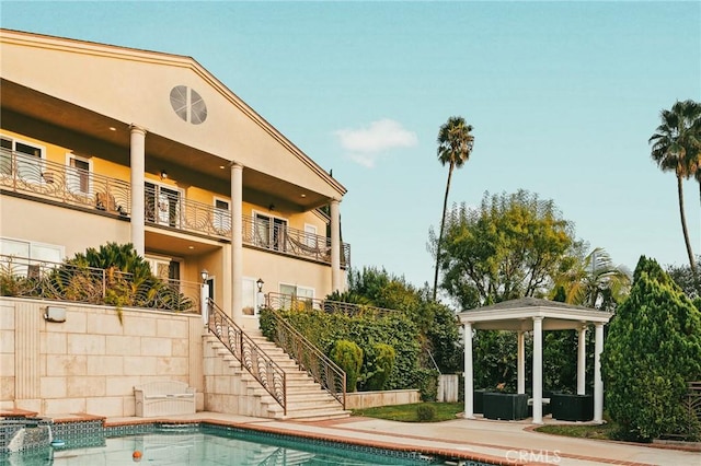 view of swimming pool featuring a gazebo