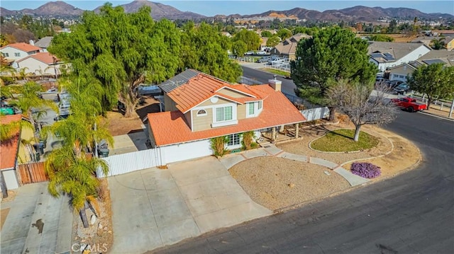 birds eye view of property featuring a mountain view