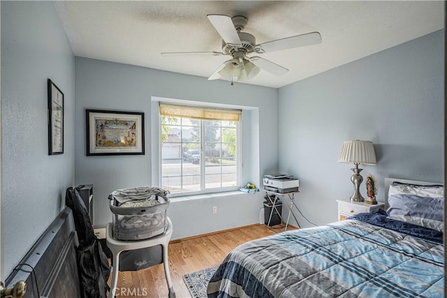 bedroom featuring ceiling fan and wood-type flooring