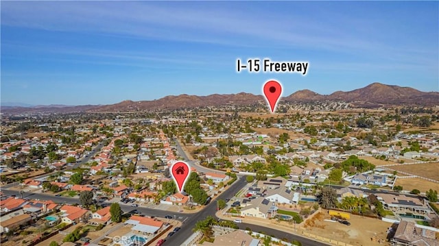 birds eye view of property featuring a mountain view