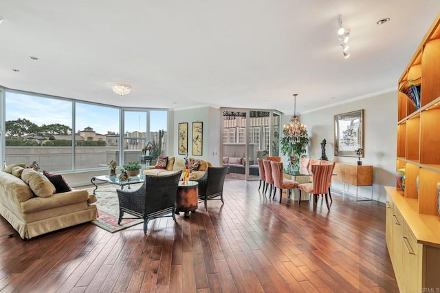 living room with dark hardwood / wood-style flooring and ornamental molding