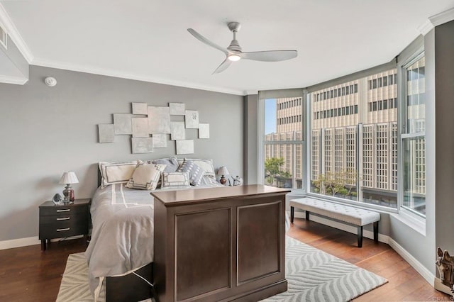 bedroom with ceiling fan, wood-type flooring, and ornamental molding