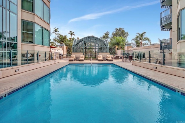 view of swimming pool featuring a patio area and outdoor lounge area