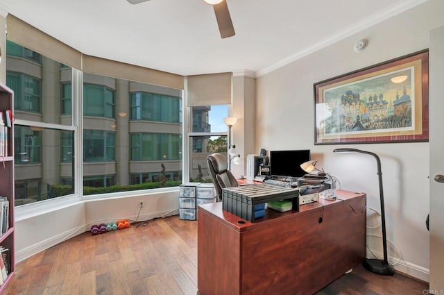 office space with hardwood / wood-style flooring, ceiling fan, crown molding, and plenty of natural light