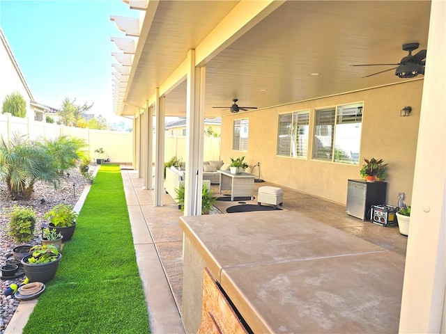 view of patio with ceiling fan