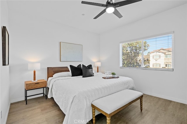 bedroom featuring ceiling fan and light hardwood / wood-style floors