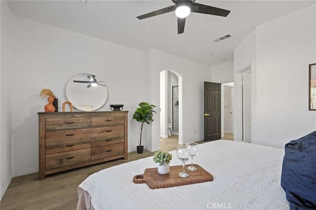 bedroom with ceiling fan and hardwood / wood-style flooring