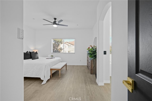 bedroom with ceiling fan and light wood-type flooring