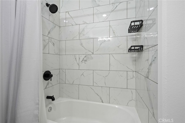 bathroom with shower / bath combination with curtain