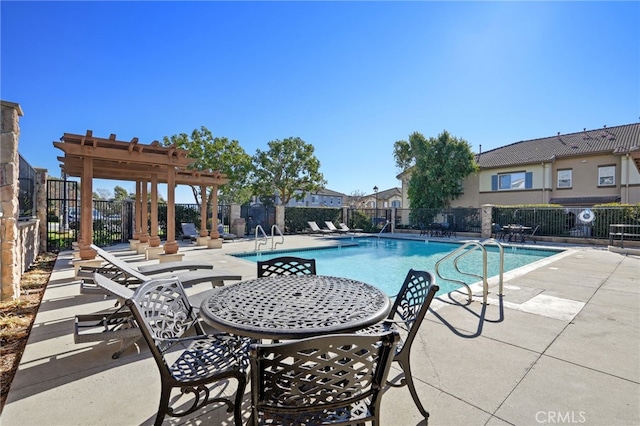 view of swimming pool with a pergola and a patio