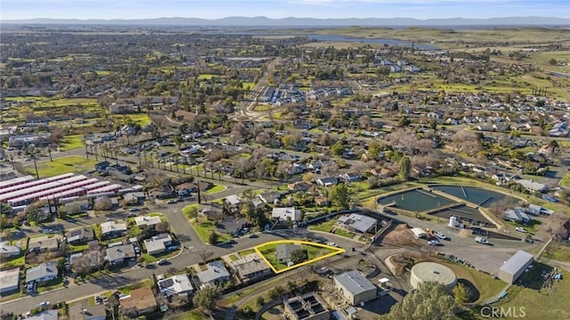 drone / aerial view featuring a residential view and a mountain view