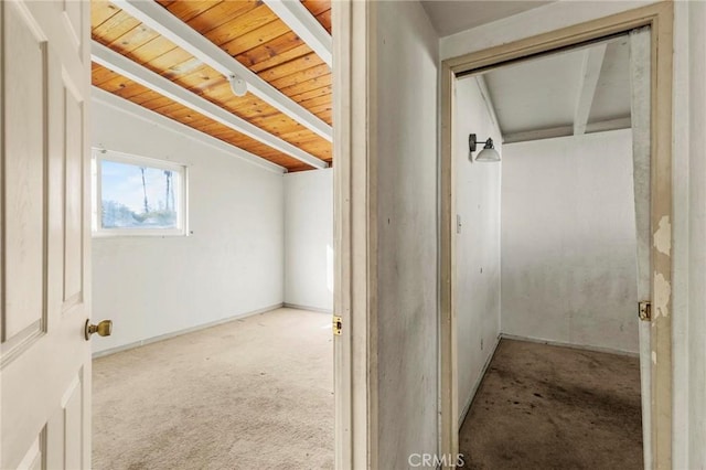 hall with wood ceiling, carpet flooring, and vaulted ceiling with beams