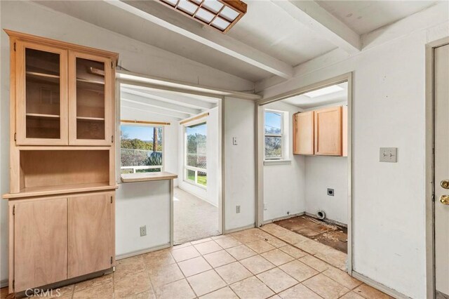 interior space with lofted ceiling with beams