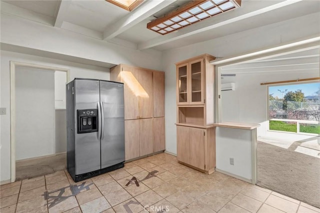 kitchen with light countertops, glass insert cabinets, light carpet, beamed ceiling, and stainless steel fridge with ice dispenser