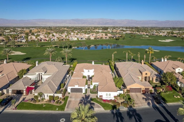 bird's eye view with a water and mountain view