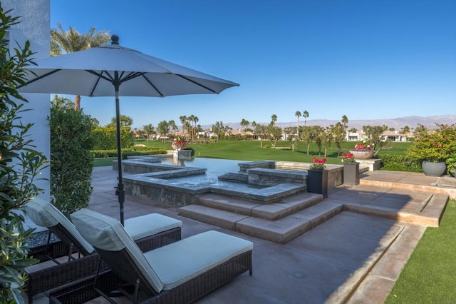 view of patio / terrace with a mountain view