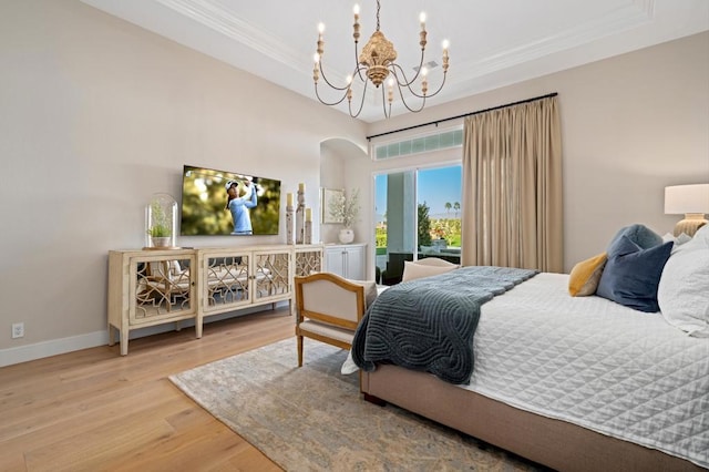 bedroom with a chandelier and hardwood / wood-style flooring