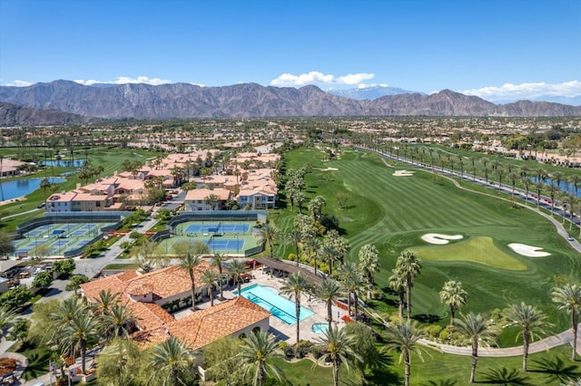 birds eye view of property with a water and mountain view