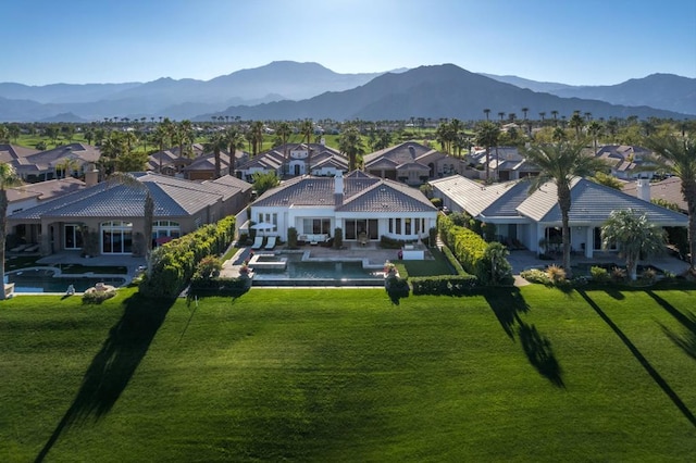 birds eye view of property with a mountain view