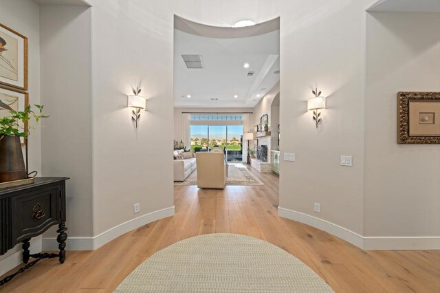 corridor with light hardwood / wood-style floors