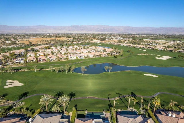 birds eye view of property featuring a water and mountain view