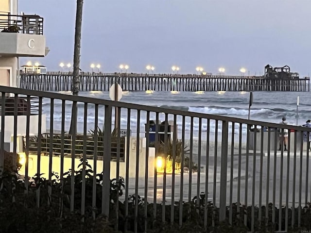 view of gate featuring a water view