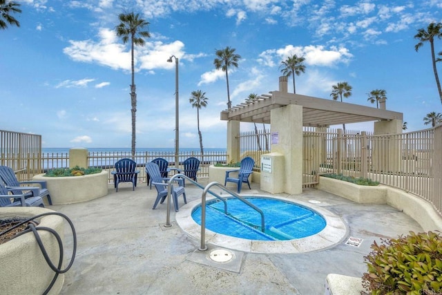 view of swimming pool with a pergola, a hot tub, a patio, and a water view