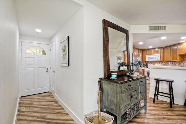 foyer entrance featuring hardwood / wood-style floors