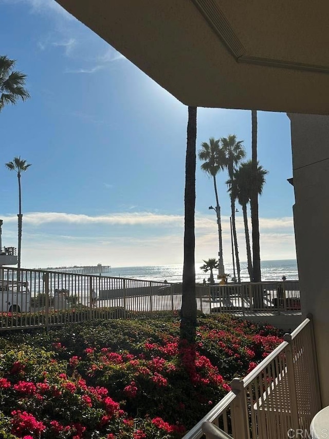 exterior space with a beach view and a water view