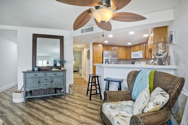 interior space featuring light hardwood / wood-style flooring and ceiling fan