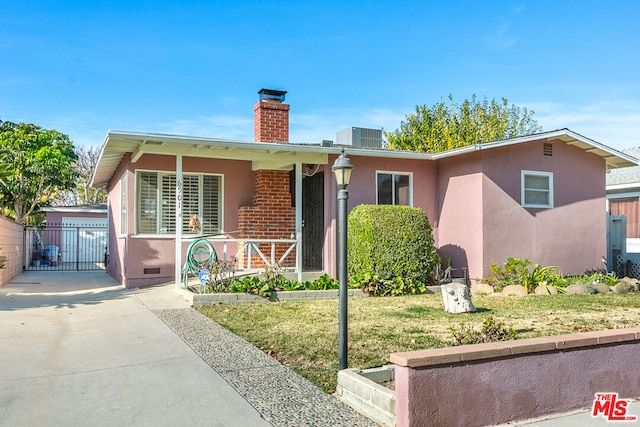 view of front of property with cooling unit and a front lawn