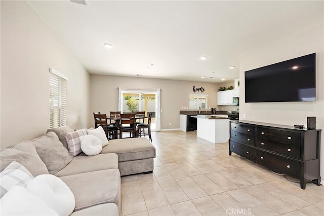 living room featuring light tile patterned flooring