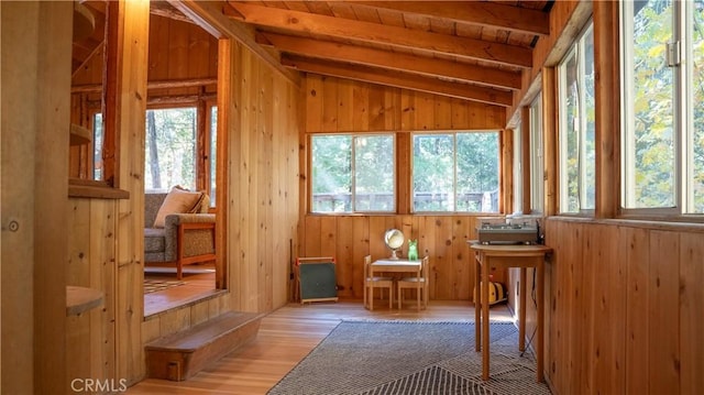 unfurnished sunroom with vaulted ceiling with beams and wooden ceiling