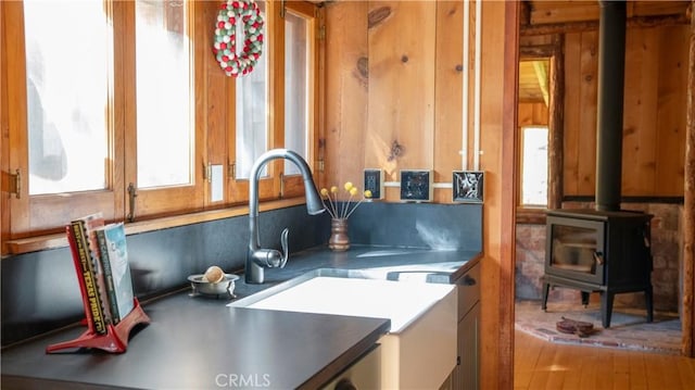 kitchen with a wood stove and sink