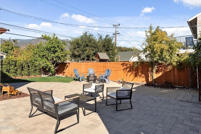 view of patio / terrace with an outdoor fire pit