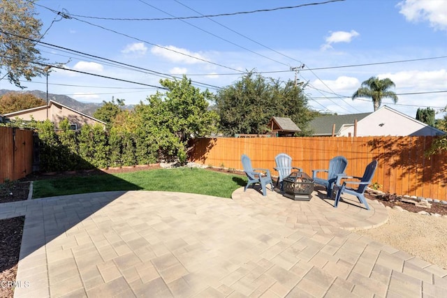 view of patio / terrace with an outdoor fire pit