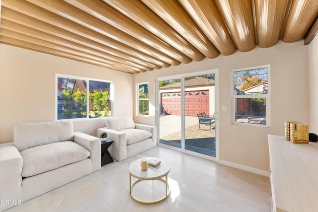 living room featuring beam ceiling