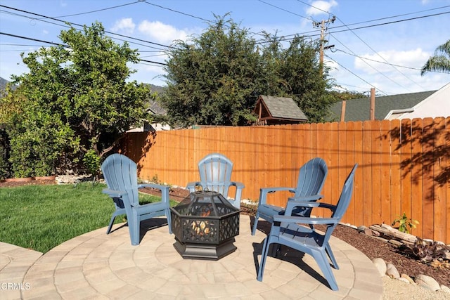 view of patio / terrace featuring a fire pit